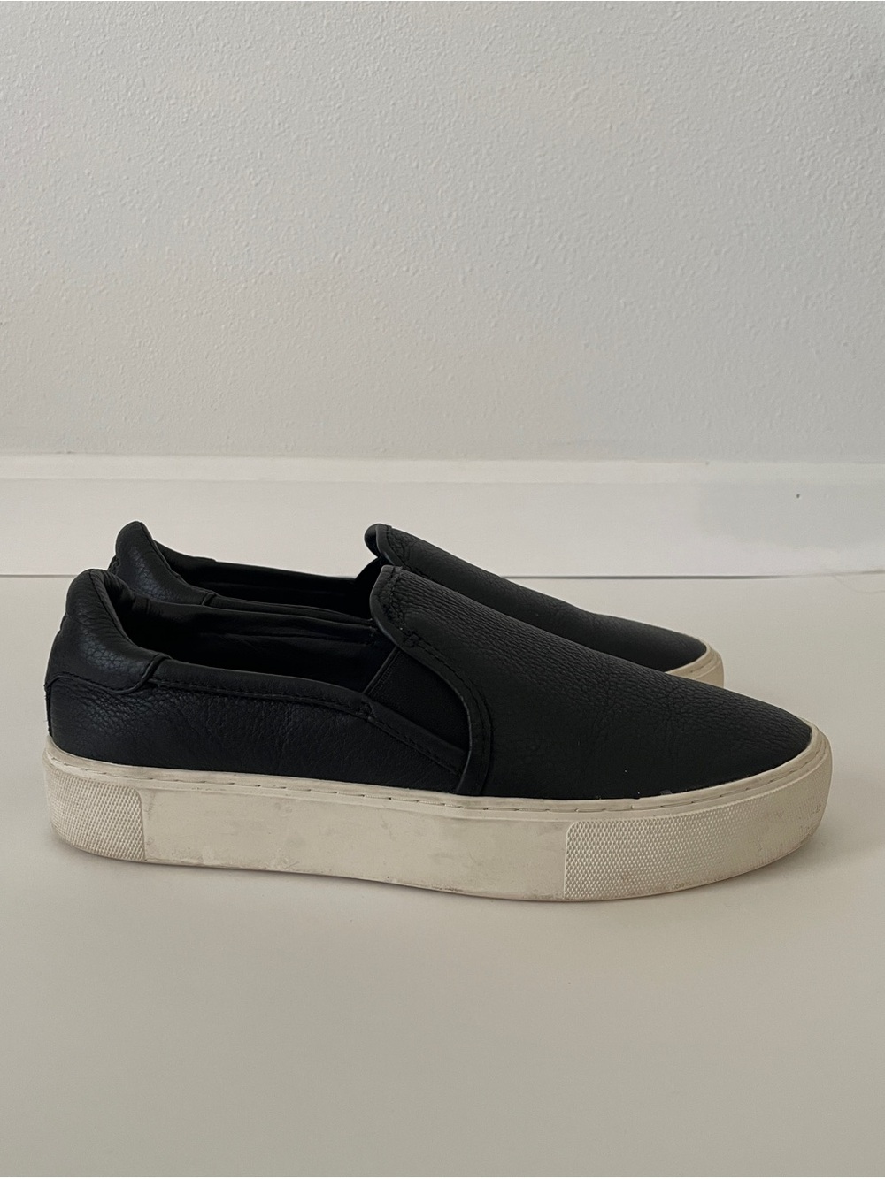 UGG Black Leather Slip-On Sneakers